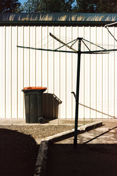 Simple Backyard Scene with Clothesline and Bin