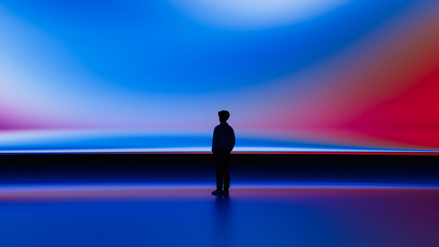 Human silhouette observes screen in a tech setting