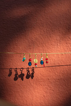 Handmade colorful beaded charms and earrings on a chain