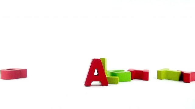 The word EQUALITY with painted wooden letters 