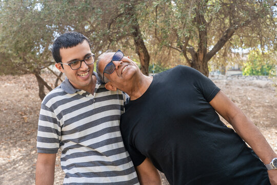 Candid Moment of Support Between Father and Son