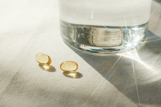 Glass of water and vitamin pills