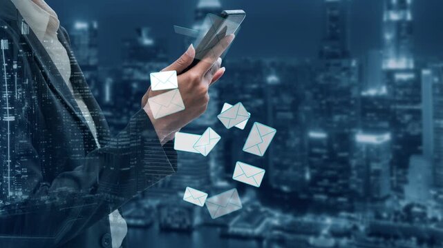 Modern Businessman Using Smartphone with Floating Email Icons in a Digital Cityscape Background at Night for Communication and Connectivity Concepts. Entropy.