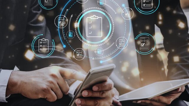 Business professionals analyzing project data with mobile technology, charts, and digital icons representing checklist and tasks for productivity improvement. Entropy.