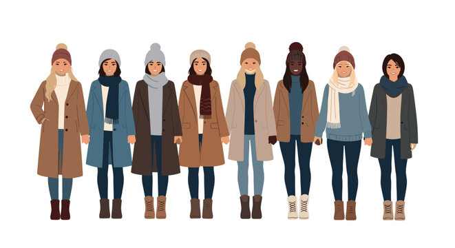 Row of diverse women wearing warm winter coats, scarves, and pom-pom beanies standing together in a line for a cold weather group portrait.