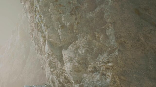 A large rock stands tall in a quiet area. The natural texture of the stone shows details under soft light. The scene is calm and shows the beauty of nature in its raw state.