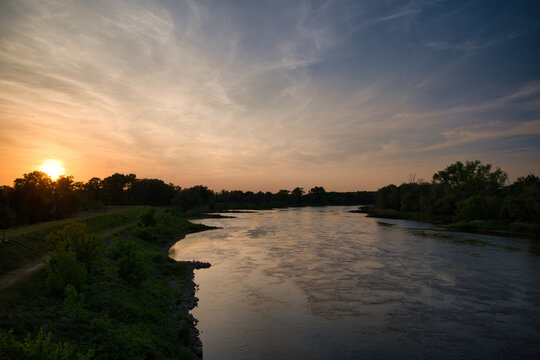 Sunset Over Calm Odra River Landscape With Trees and Reflected Sky at Dusk - City Of Bytom Odrzański.