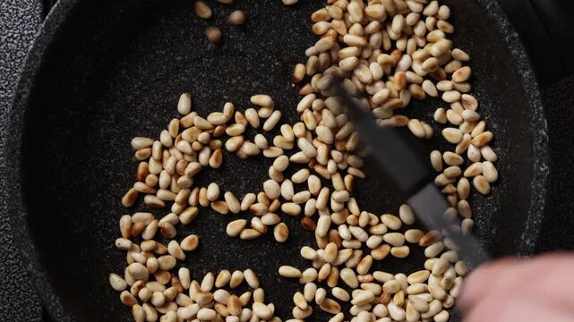 Stirring Pine Nuts Close Up Top View