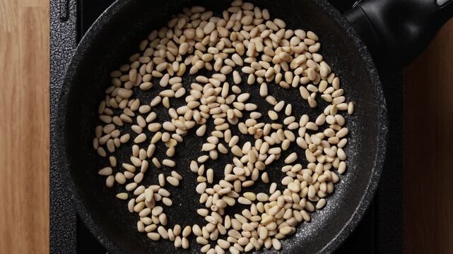 Stirring Pine Nuts Close Up Top View