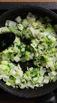 Stirring Vegetables In Pan Top View Vertical