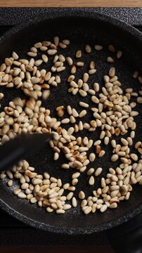 Toasting Pine Nuts Close Up Top View Vertical