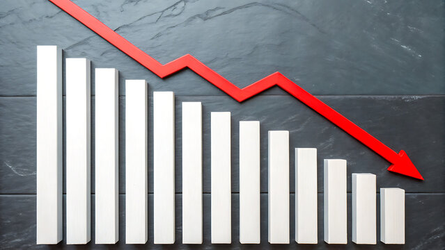 A white bar chart showing a downward trend with a red arrow pointing down against a dark gray slate stone background, representing economic loss