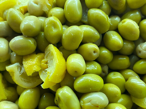 Close-up of marinated green olives with lemon at a Moroccan delicatessen