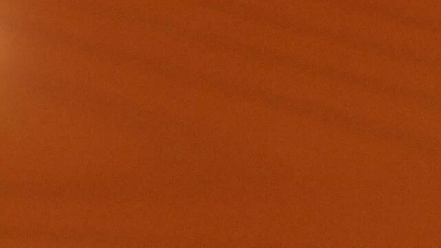 Low Light Orange Scene Shimmering Surface in Warm Ambient Setting