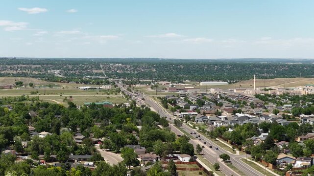 Aerial of suburban sprawl and Wadsworth major thoroughfare in Littleton Colorado Jefferson County with dense housing development and commercial areas