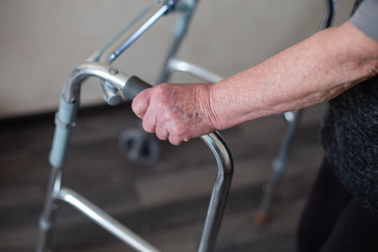 Senior woman using a walker for mobility support