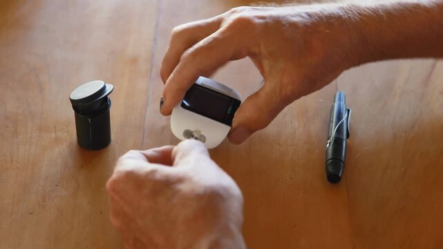 hand holding glucose sugar blood test diabetes 