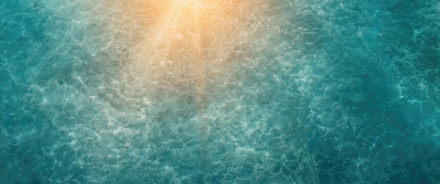 Overhead view of a sprawling sandy ocean floor bathed in underwater light rays crafting a quiet abstract scene
