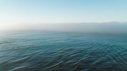Fototapeta premium Ocean waves under a thick fog bank water