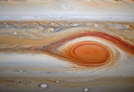 Stunning view of Jupiter iconic Great Red Spot, a massive, swirling anticyclonic storm. The vibrant oval is surrounded by turbulent atmospheric bands, dynamic and violent gas giant weather patterns