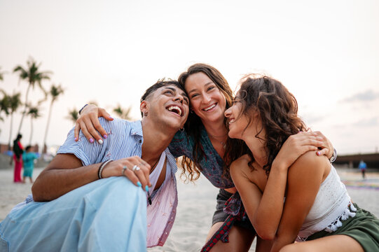 Happy college students on a summer trip, enjoying freedom and fun at the seaside resort