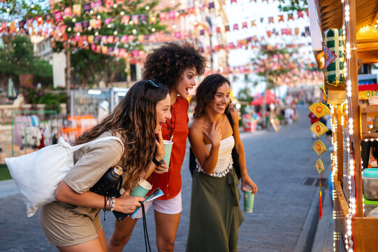 Diverse group of friends celebrates joy and togetherness while traveling, expressing pure happiness