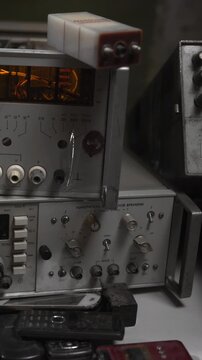 Old Audio Equipment And Workspace. Salvage Workshop Showcasing Classic Audio Gear And Repair Tools . Media
