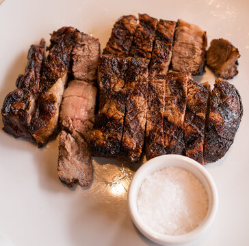 Sliced Grilled Steak Served with Sea Salt

