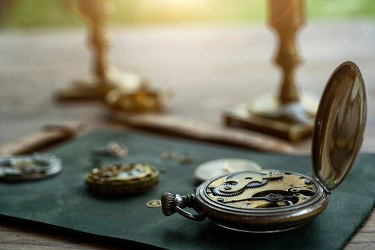 Watchmaker repairing vintage mechanical watches in an antique workshop