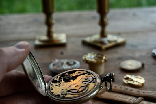 Traditional watchmaker workshop with vintage mechanical watches and tools