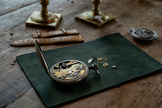 Traditional watchmaker workshop with vintage mechanical watches and tools