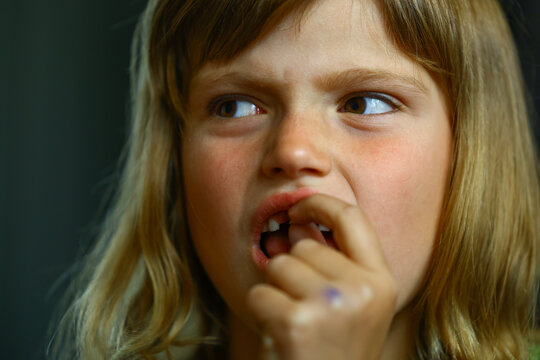 Happy child proudly displays the gap left by a recently lost baby tooth