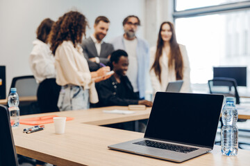 Fototapeta premium Diverse business team collaborating in a modern office meeting