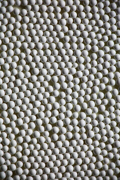 Abstract background of small white porcelain beads texture