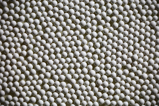 Abstract background of small white porcelain beads texture