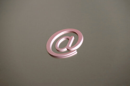 email symbol paperclips on iron plate background, concept of internet communication