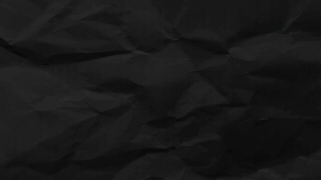 Black crumpled paper texture stop motion loop. Minimalist wrinkled paper background animation for creative title card and transition.