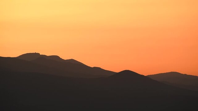 Beautiful mountain sunset with vivid warm color tones