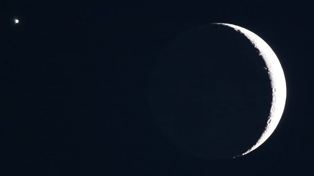Astronomy telescope video of celestial conjunction with crescent moon ashen light and Venus