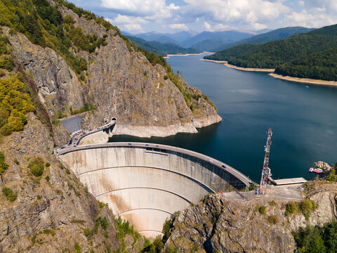 Barajul Vidraru Dam on Transfagarasan Highway, Romania. Aerial panoramic drone view from above, top view from drone. The most beautiful road in the world, amazing scenery view