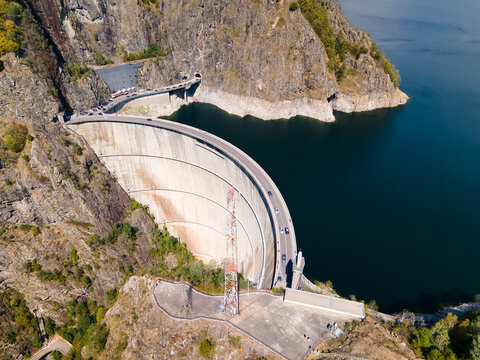 Barajul Vidraru Dam on Transfagarasan Highway, Romania. Aerial panoramic drone view from above, top view from drone. The most beautiful road in the world, amazing scenery view