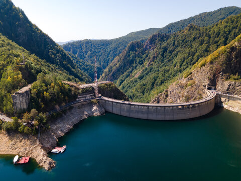 Barajul Vidraru Dam on Transfagarasan Highway, Romania. Aerial panoramic drone view from above, top view from drone. The most beautiful road in the world, amazing scenery view