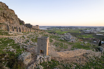 Fototapeta premium Historic Hellenistic tower overlooking the Ancient City of Sillyon in Antalya, Türkiye, preserving archaeological heritage from multiple civilizations.
