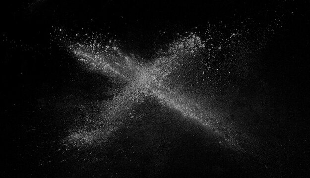 White powder scattered on black background, clipping path