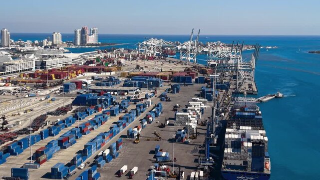 Aerial view of container ship unloading at PortMiami terminal