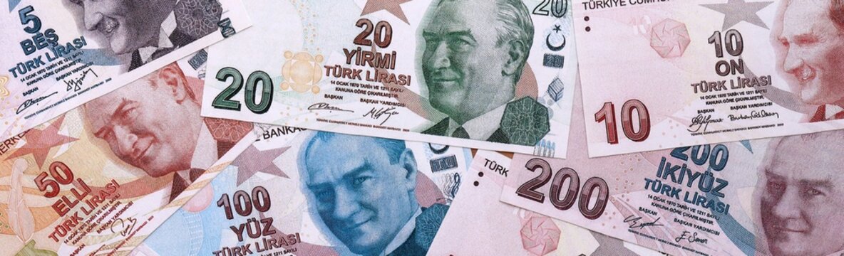 Turkish lira money bills pile on table. Turkey banknotes of TRY currency close up.