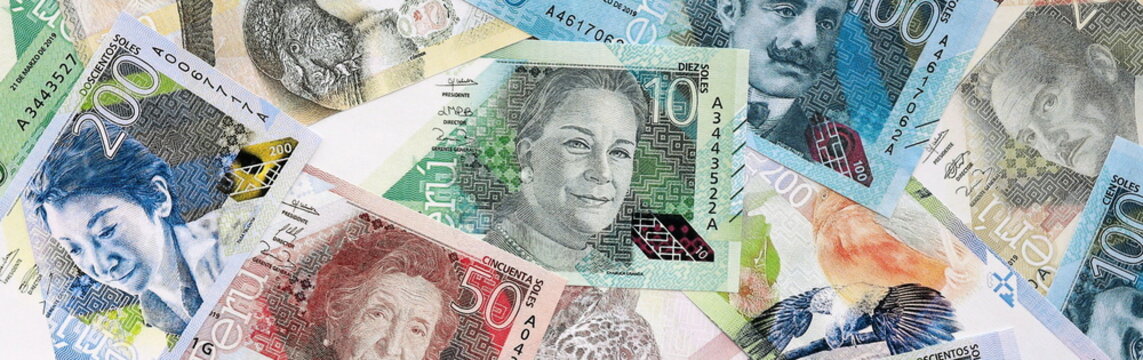 Peruvian sol money bills pile on table. Peru banknotes of PEN currency close up.