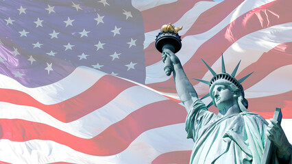 The iconic Statue of Liberty stands proudly against a backdrop of a large, waving American flag, symbolizing freedom and patriotism.