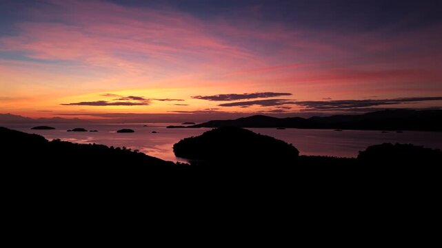 Colorful Dusk Sky Over Mountains and Sea