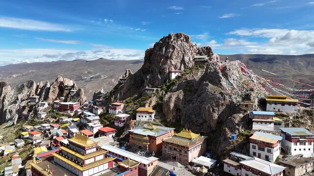 Aerial view of mountain ridges and prayer flags near Zizhu Temple in Tibet